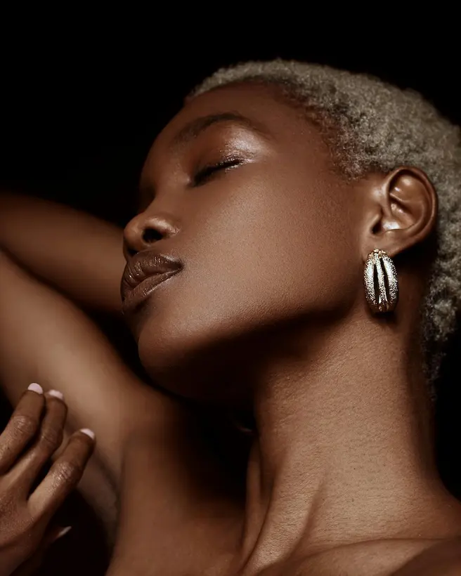 A dark skin lady showing face and neck