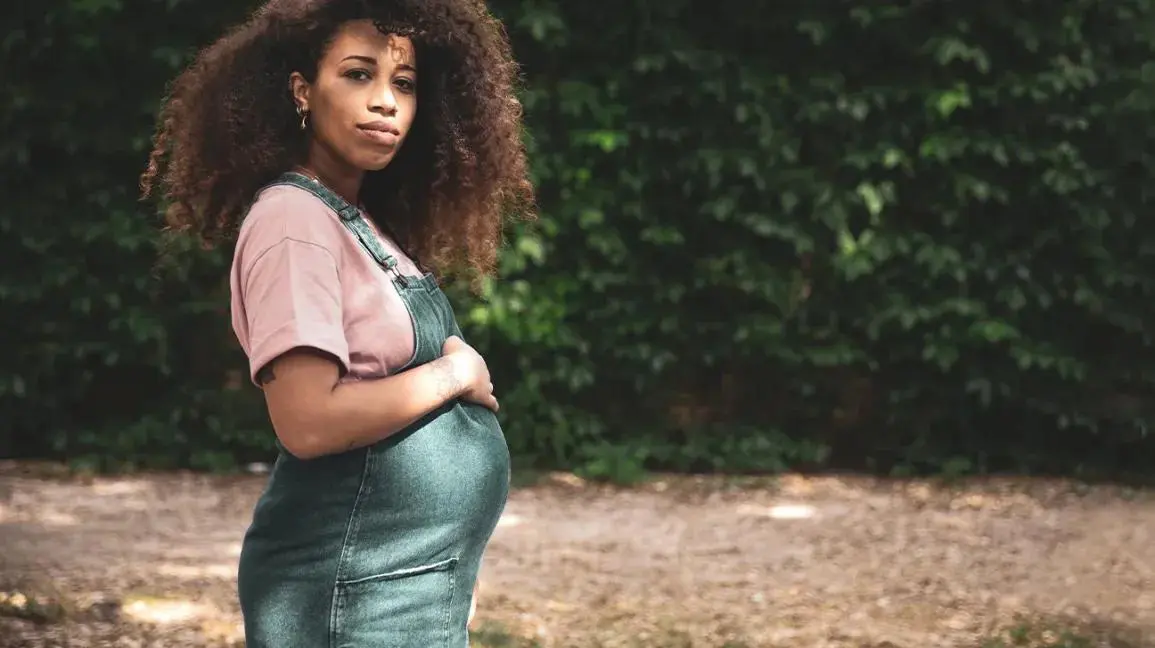 woman in her first trimester of pregnancy