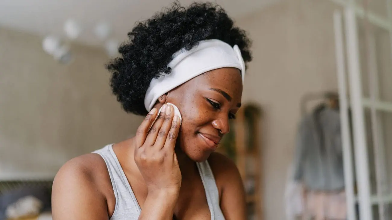 a woman with a white headband and a white towel on her head