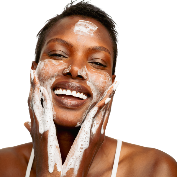 A woman cleansing her face.