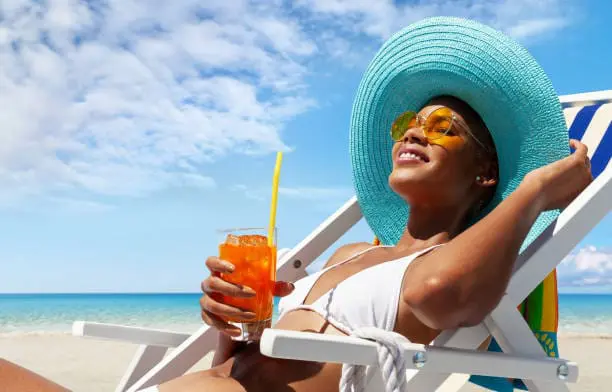 Woman sunbathing in the beach